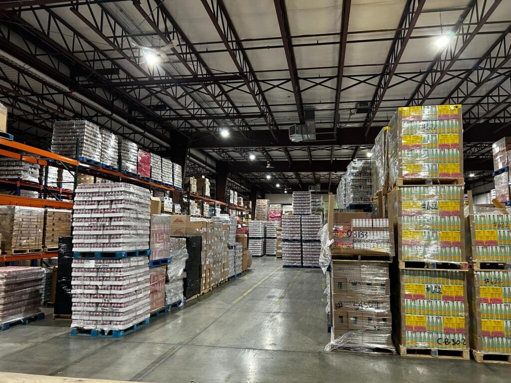 Thomas Trading warehouse with pallets of grocery goods