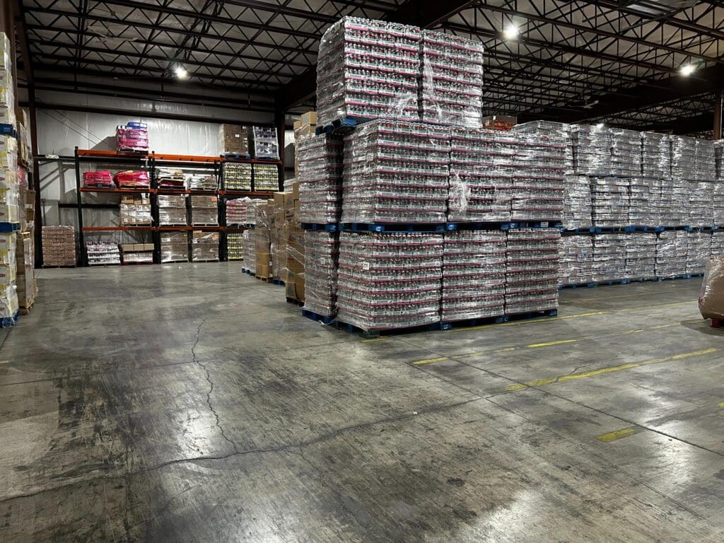 Thomas Trading warehouse with pallets of discounted food